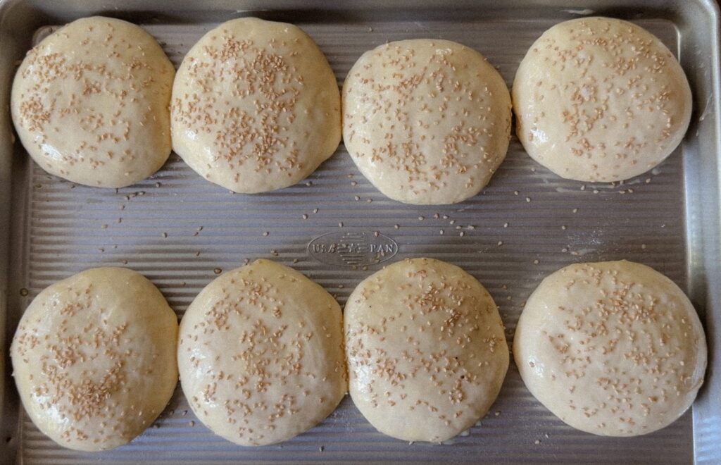 Soft sourdough hamburger buns topped with sesame seeds
