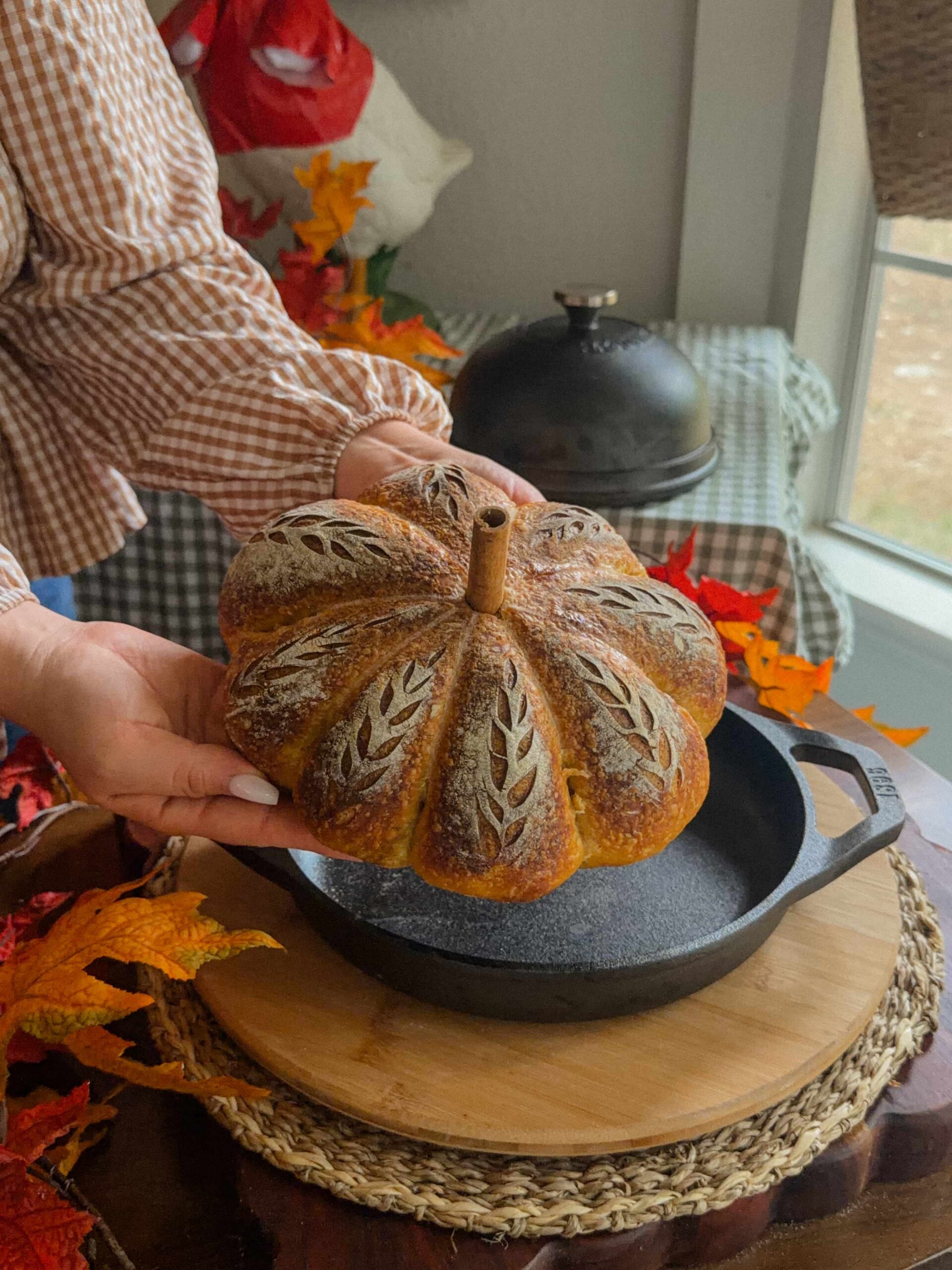 Pumpkin-shaped sourdough bread with cinnamon stick stem