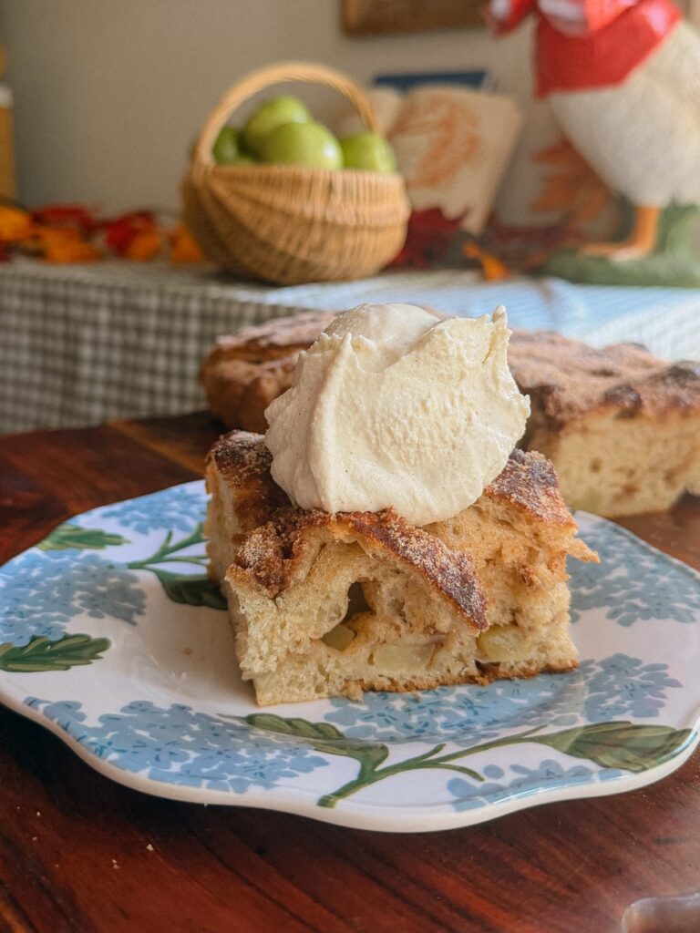 Slice of apple cider focaccia served warm with vanilla ice cream