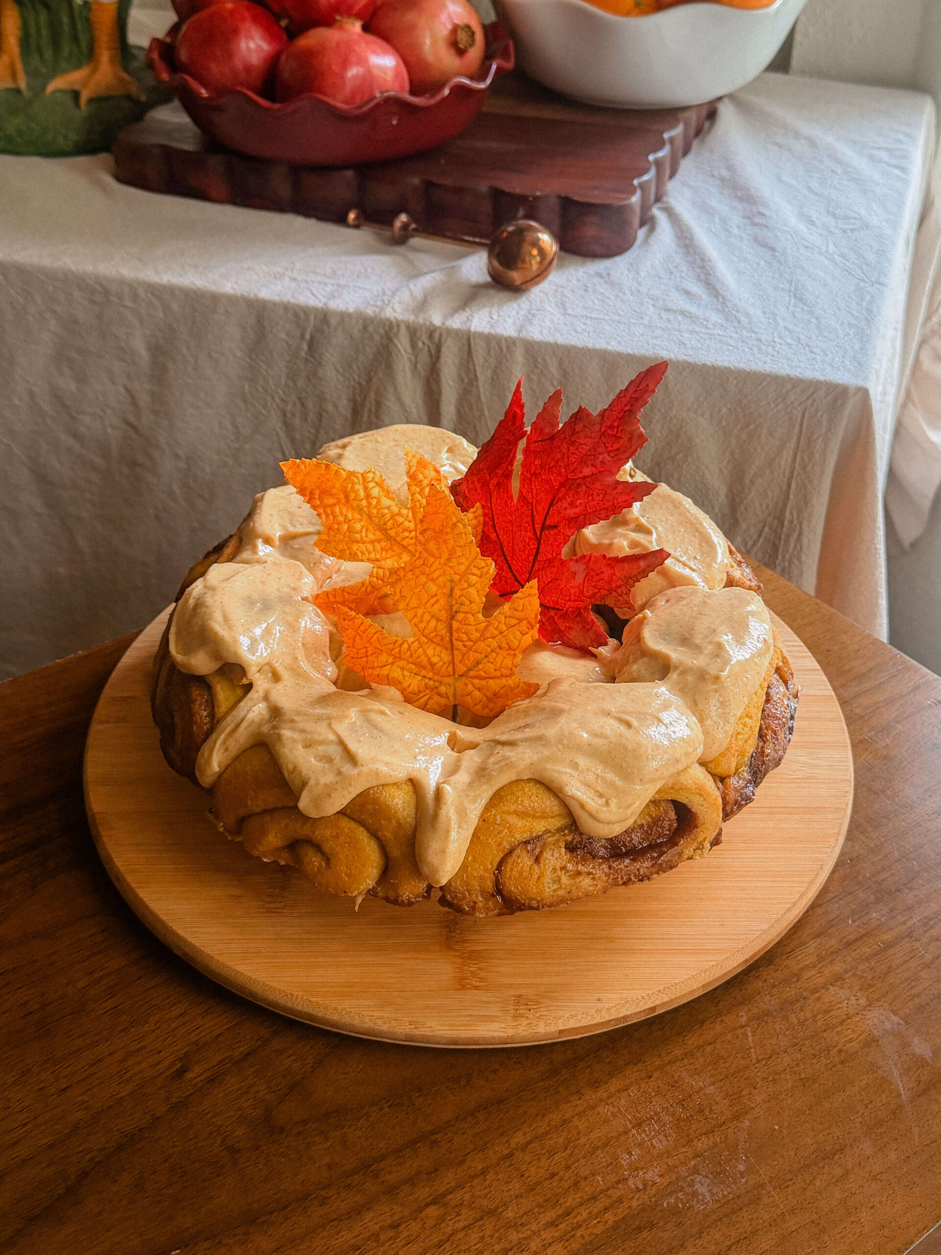 Pumpkin sourdough cinnamon rolls topped with brown butter pumpkin frosting